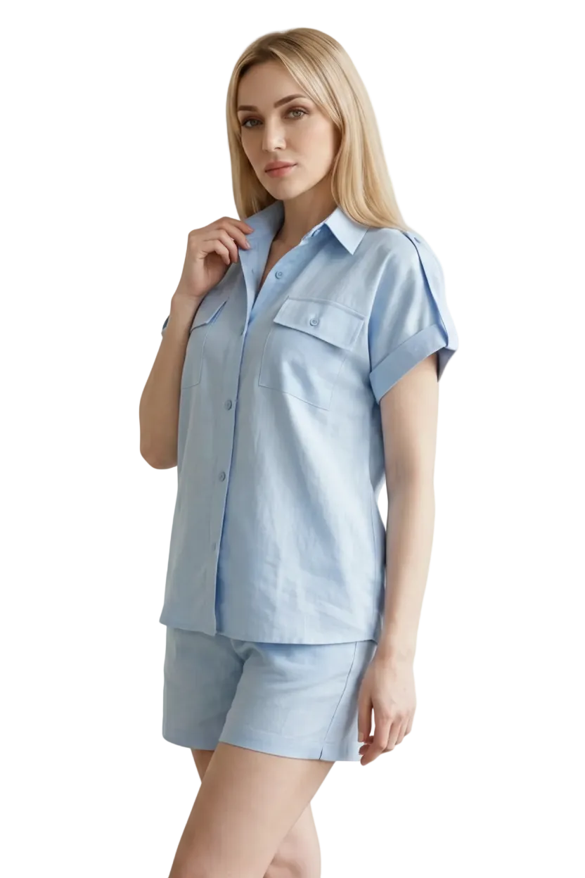 Woman wearing a light blue linen-look shirt and shorts set