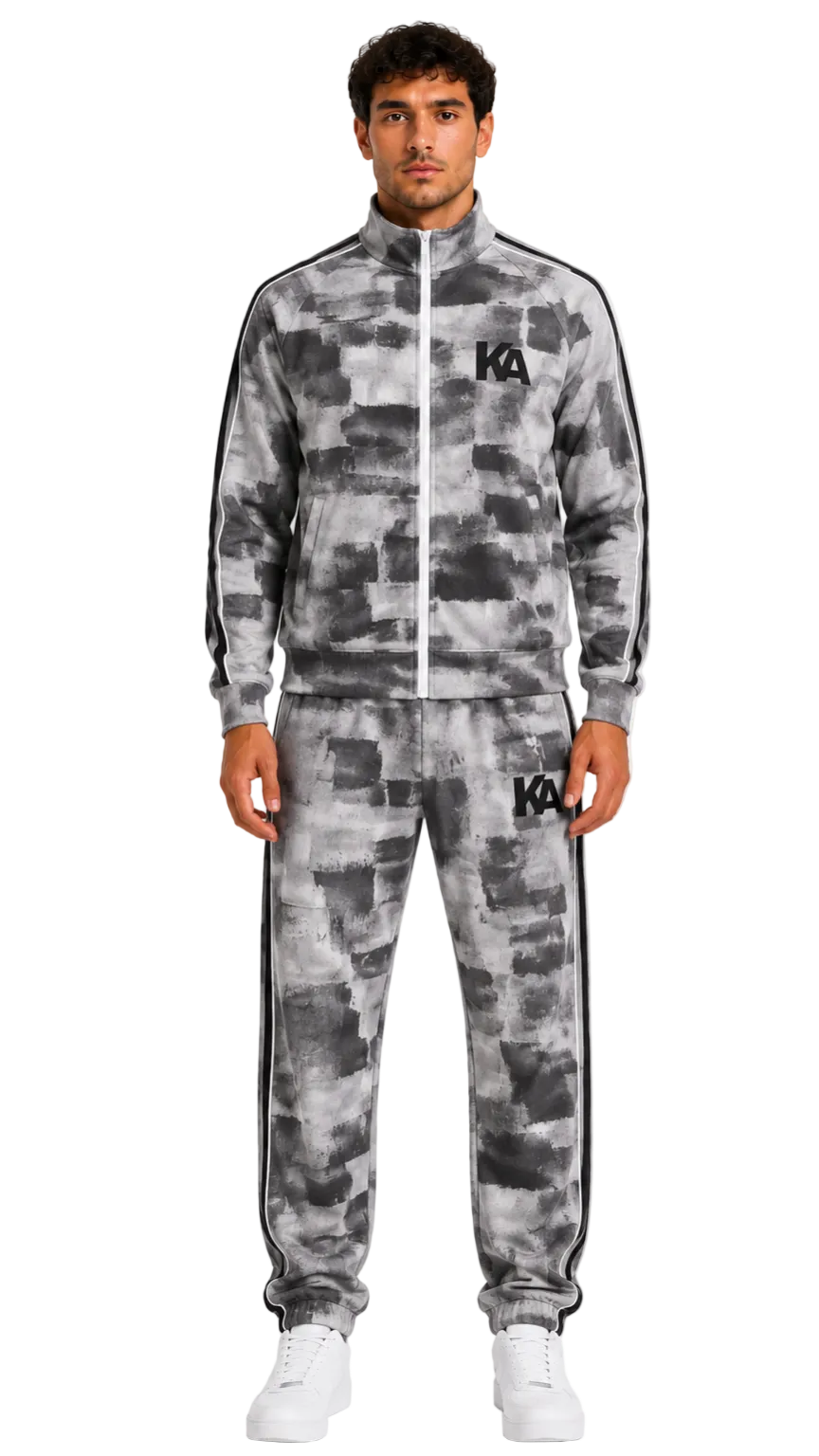 Man wearing a grey and black zip tracksuit