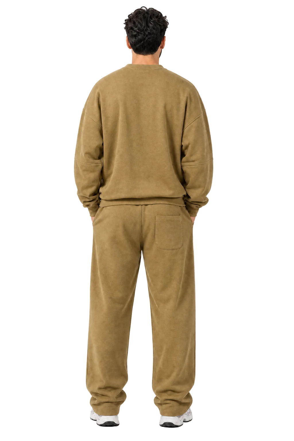 A man viewed from behind wearing a matching two-piece lounge set consisting of a crewneck sweatshirt and relaxed-fit pants in a warm khaki-brown color, set against a light gray studio background.