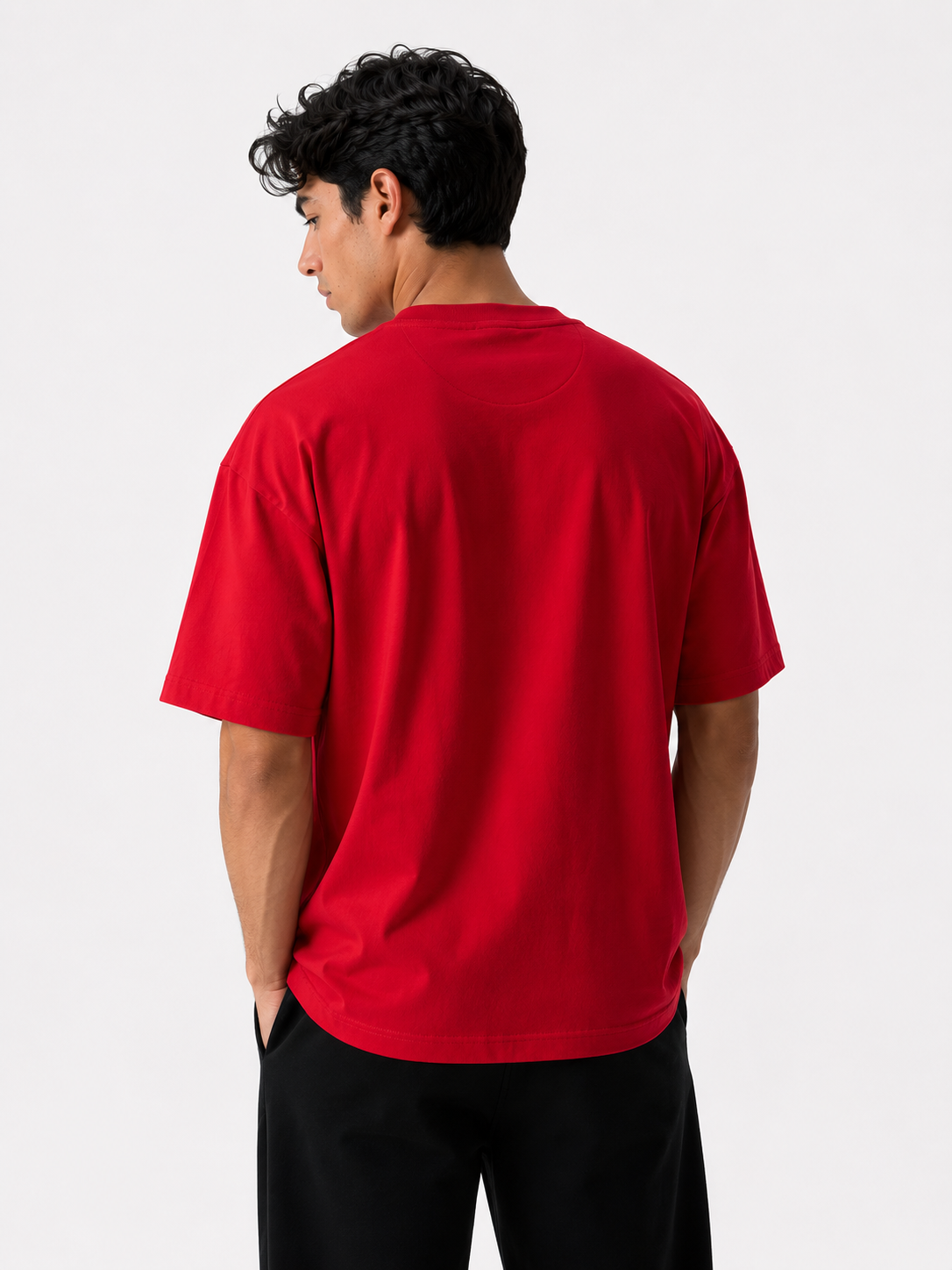Male model wearing a red oversized premium cotton t-shirt with embroidered white LF logo on a clean white studio background.