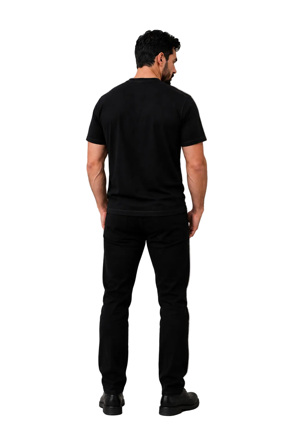 A man viewed from behind wearing a black short-sleeve t-shirt and black pants, standing against a neutral gray studio background with soft shadows.