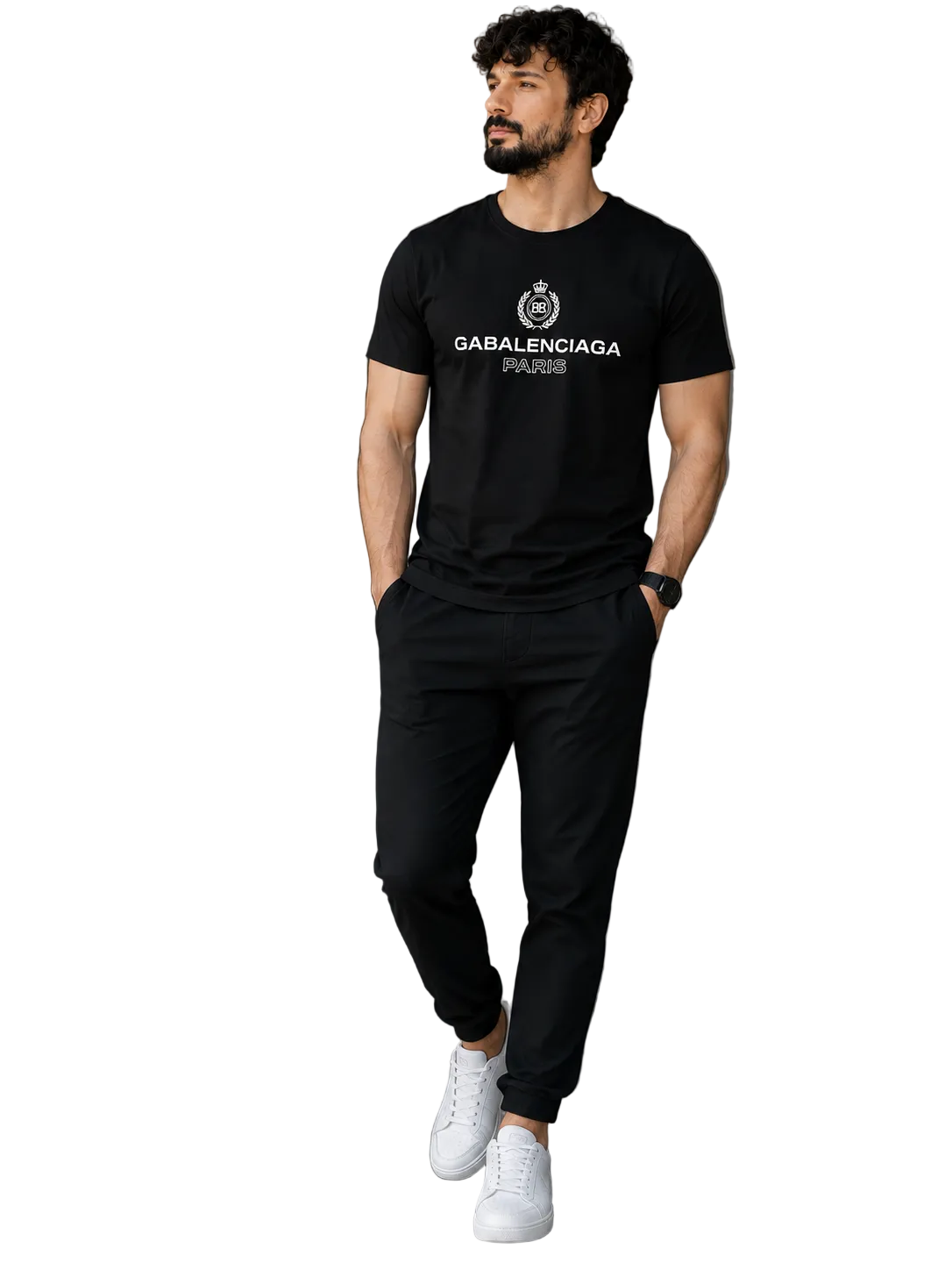 A man wearing a black Balenciaga short-sleeve t-shirt with a white logo, black jogger pants, and white sneakers, standing in a modern indoor setting with a glass door and staircase.