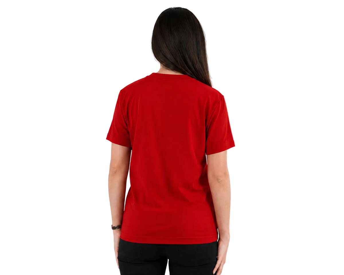 A woman viewed from behind wearing a solid red short-sleeve crewneck t-shirt and black pants, standing against a plain light gray studio background.