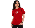 A woman modeling a red short-sleeve t-shirt with a white printed Dolce & Gabbana Milano logo on the chest, set against a plain light gray background.