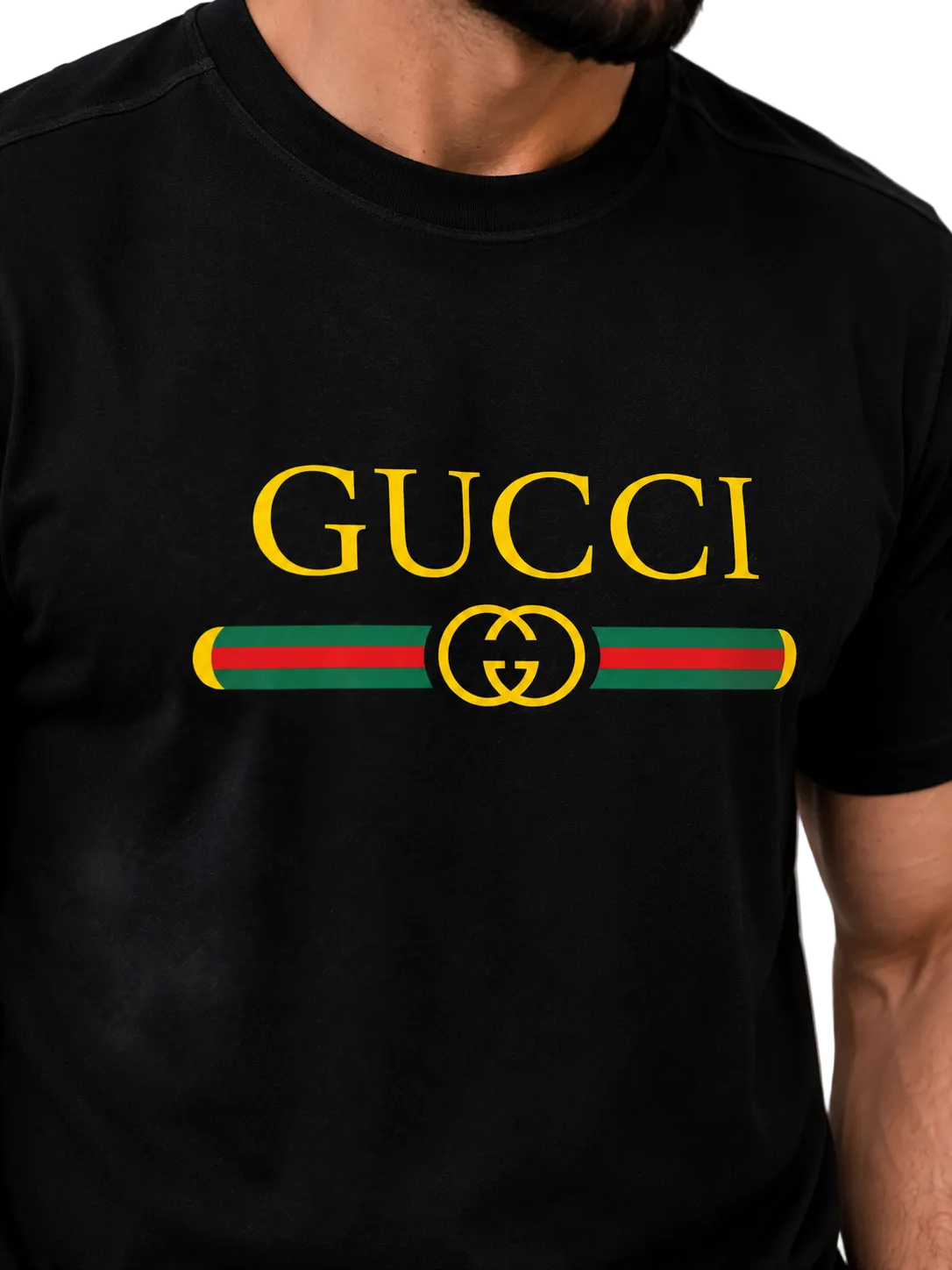 A close-up of a man wearing a black Gucci t-shirt featuring a large yellow 'GUCCI' logo and the iconic green and red web stripe with a yellow interlocking GG logo on the chest.