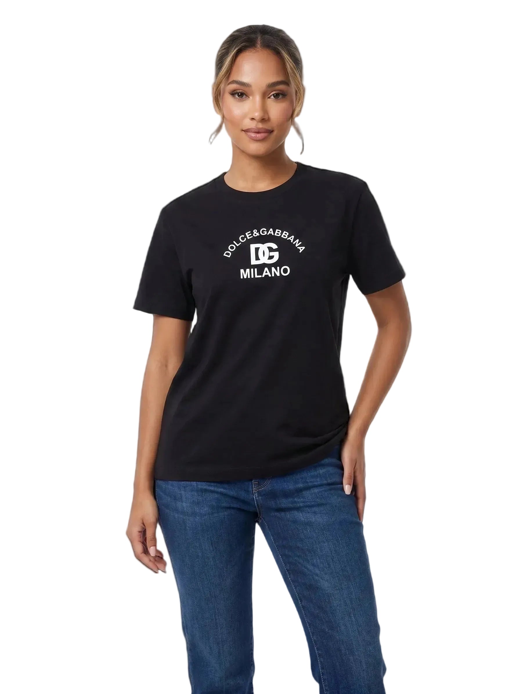 A woman modeling a black short-sleeve crewneck t-shirt with a white printed 'DOLCE&GABANA MILANO' logo on the chest, paired with blue jeans against a plain white background.