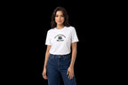 A woman modeling a white short-sleeve t-shirt with a black 'DOLCE&GABBA MILANO' logo printed on the chest, paired with dark blue jeans, against a plain white studio background.
