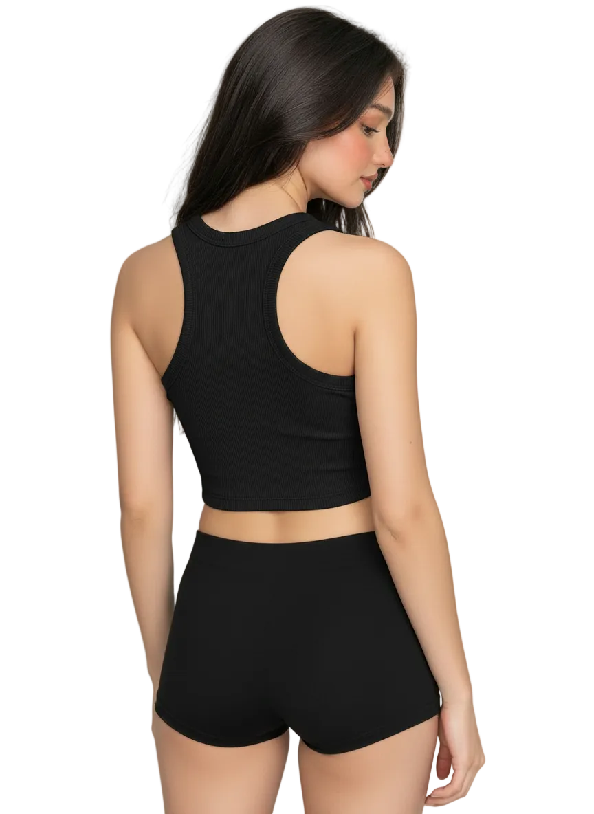 A woman shown from the back wearing a black ribbed crop top and matching high-waisted shorts against a plain light gray studio background.