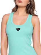 A close-up of a woman wearing a mint green ribbed tank top with a black triangular Prada logo patch on the chest, set against a plain white background.
