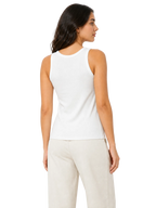 A woman shown from the back wearing a fitted white sleeveless tank top and light beige pants against a plain white studio background.