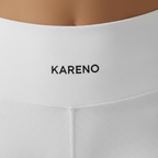 White women’s fitted activewear set with sports bra and shorts by outfitmarket