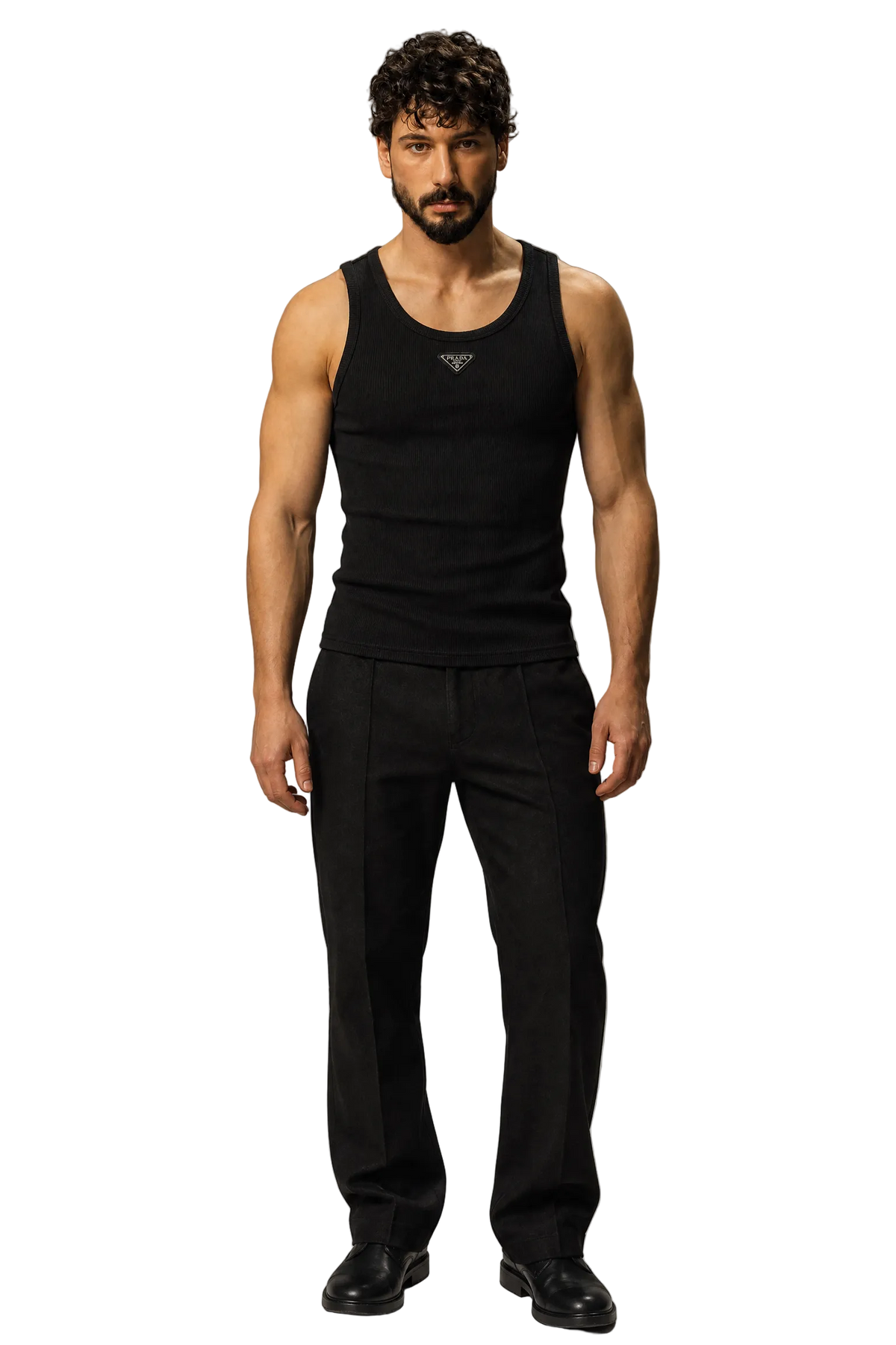 A man modeling a black sleeveless tank top with a small silver logo on the chest, paired with black trousers and black shoes, against a neutral gray studio background.